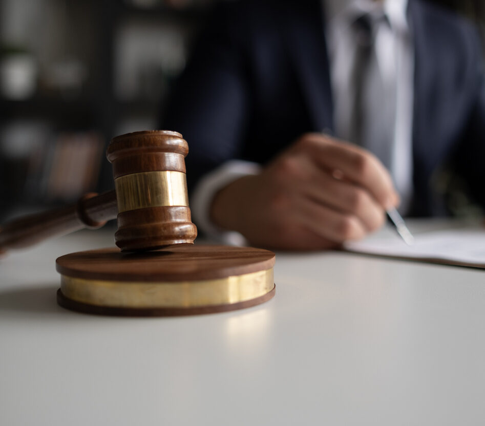 Judge or Legal advisor lawyer examining and signing legal documents.