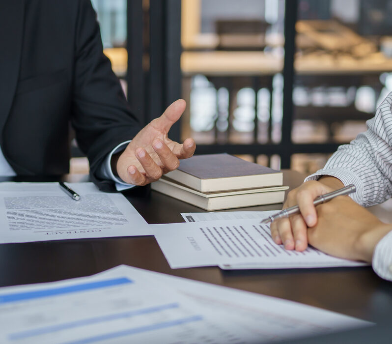 Lawyer Legal counsel presents to the client a signed contract with gavel and legal law. justice and lawyer Business partnership meeting concept