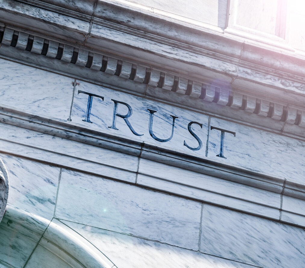 Trust word on an old stone building